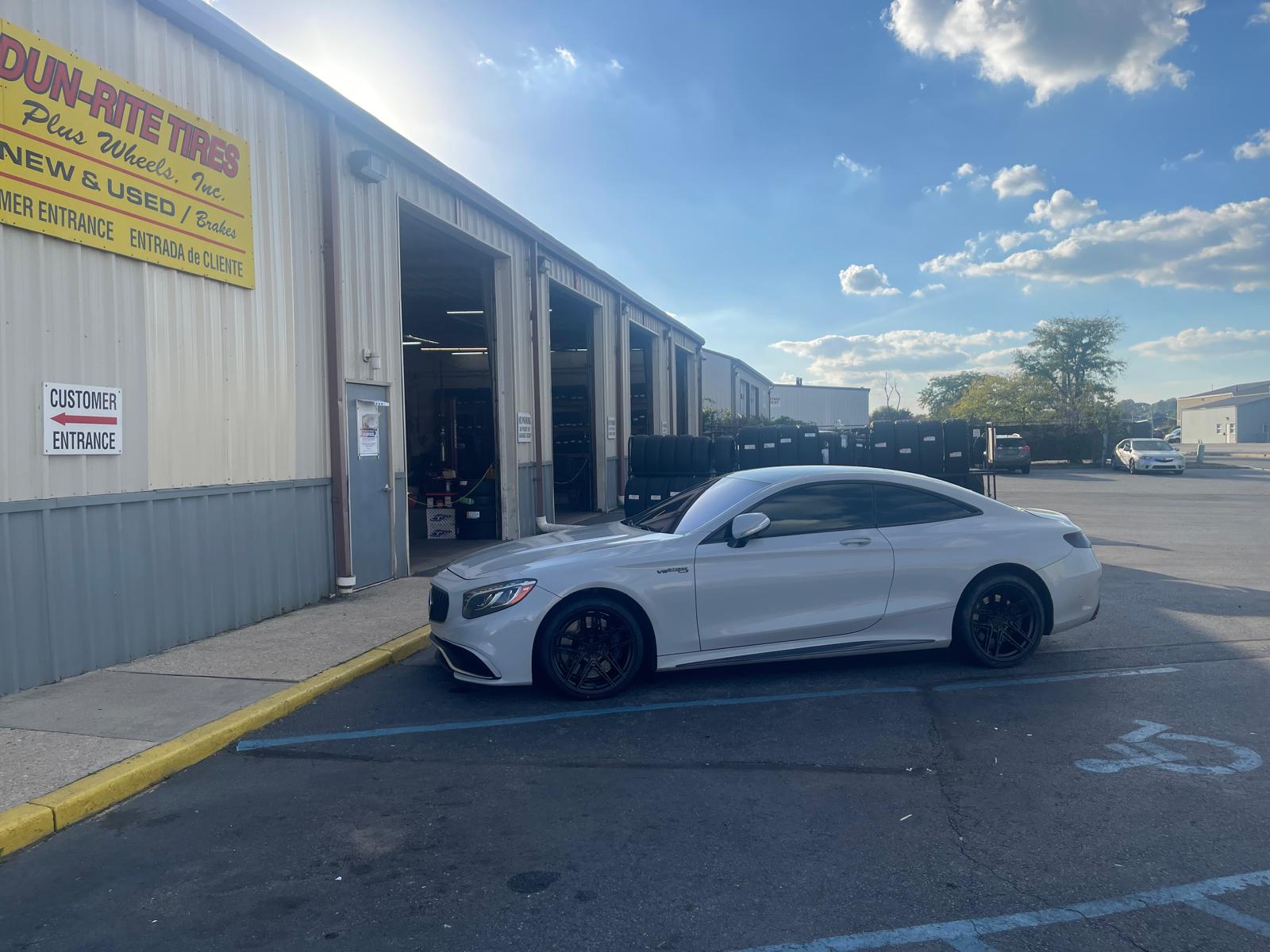 White Mercedes-AMG S-Class at Dun-Rite entrance